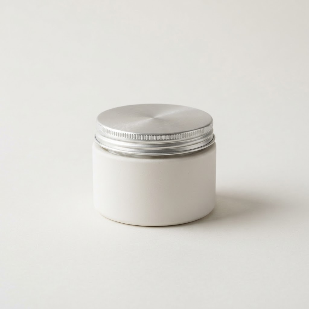 White ceramic moisturizer jar with brushed silver lid